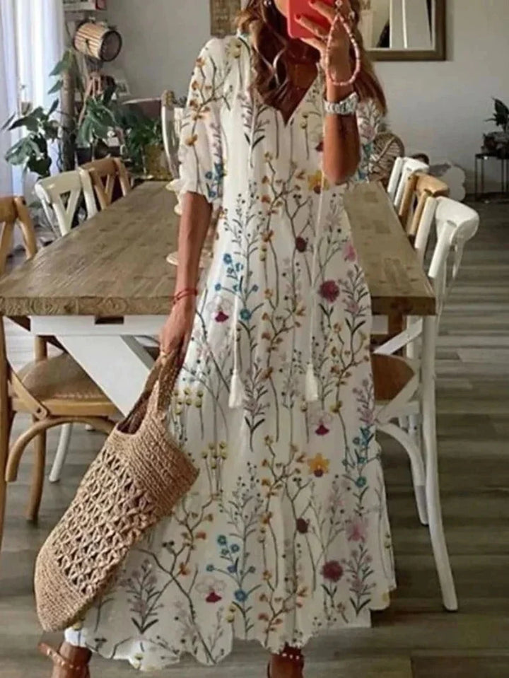 "Isabell - Elbow sleeve floral maxi dress in multiple colors, featuring a soft and flowy fabric with a colorful floral print…