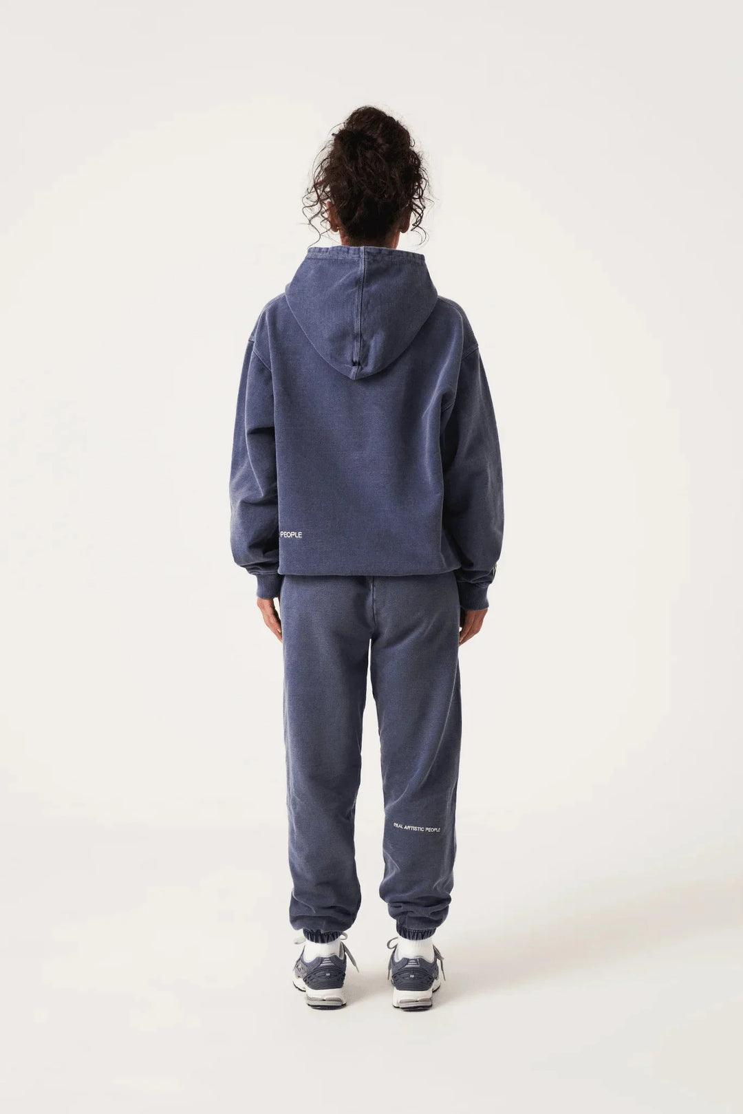 Navy unisex hoodie with statement print featuring a soft cotton blend fabric and a contemporary design.