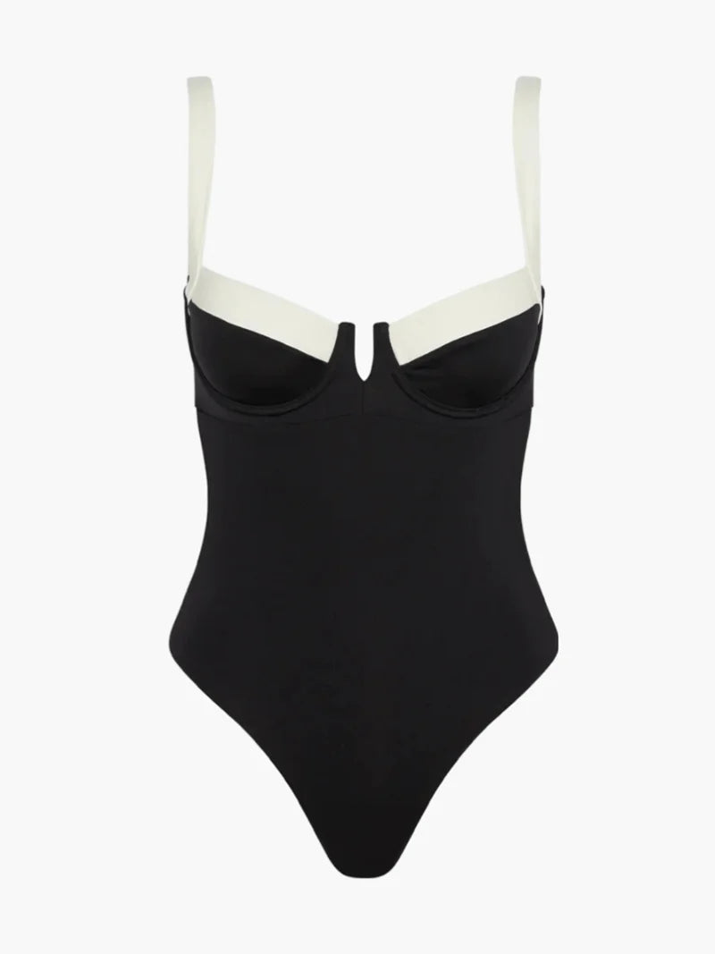 Black and ivory one-piece swimsuit, featuring a stylish color block design with a flattering cut and scoop neckline.