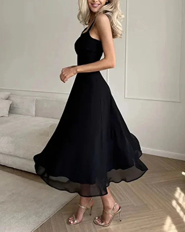 "Eliyah midi dress in black, square neckline, fitted bodice, perfect for casual or semi-formal events."