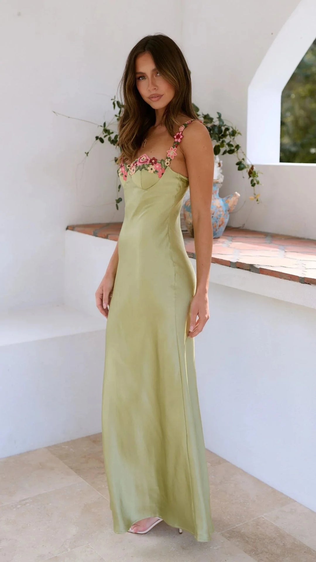 Adelynne maxi dress adorned with embroidered pink florals, a graceful ensemble perfect for special occasions.