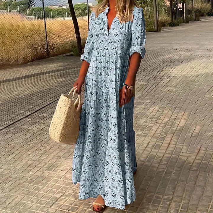 Blue V-neck maxi dress with sleeves, perfect for casual or formal occasions. Made from soft and light fabric for all-day…
