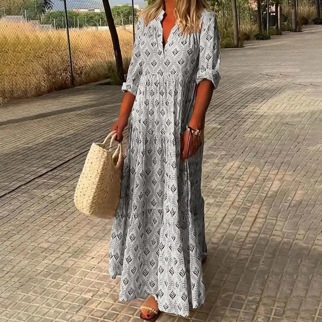 Grey V-neck maxi dress with sleeves. Made from soft and comfortable fabric. Flowy and elegant design perfect for any…