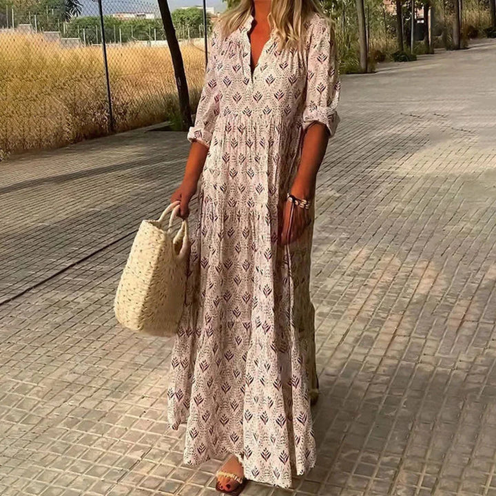 Pink V-neck maxi dress with sleeves by Makenzie, featuring a soft and flowy fabric ideal for casual wear or special occasions.