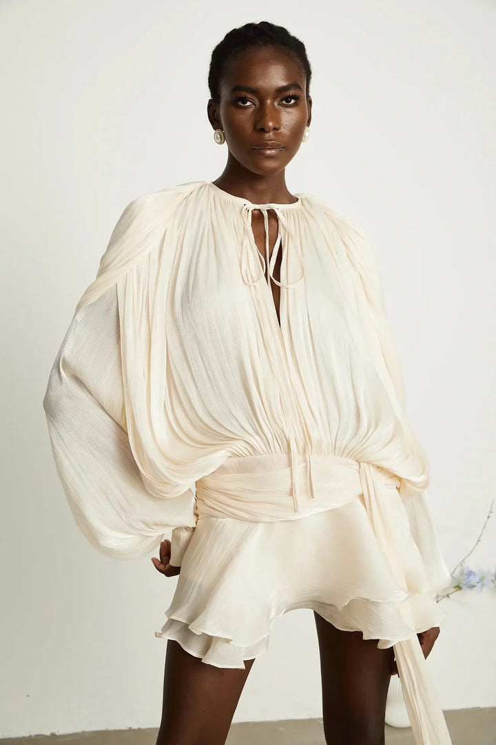 Satin mini dress in flowy design with tie accents, perfect for a chic and elegant look.