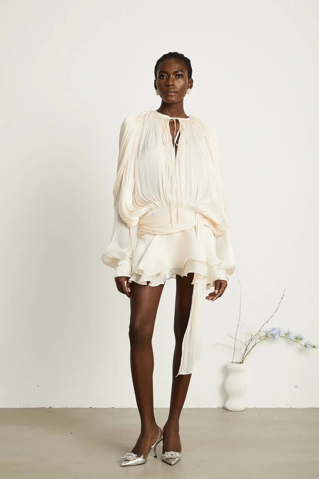 "Satin mini dress in Camiyah design with tie accents, perfect for a stylish and elegant look."