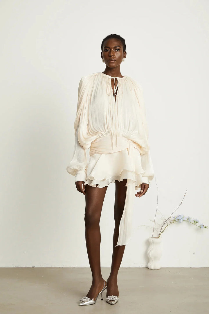 "Satin mini dress in Camiyah design with tie accents, perfect for a stylish and elegant look."