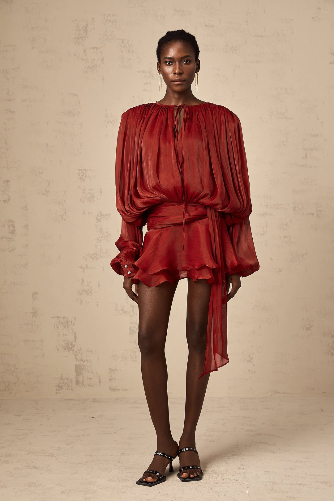 Satin mini dress with tie accents in flowing design, perfect for special occasions or a night out.