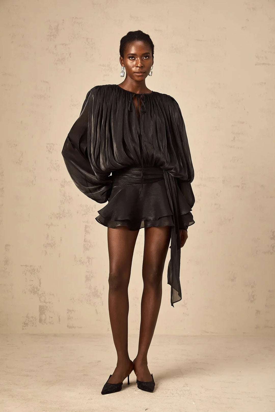 "Camiyah satin mini dress with tie accents in flowing design. Soft and elegant, perfect for any occasion."