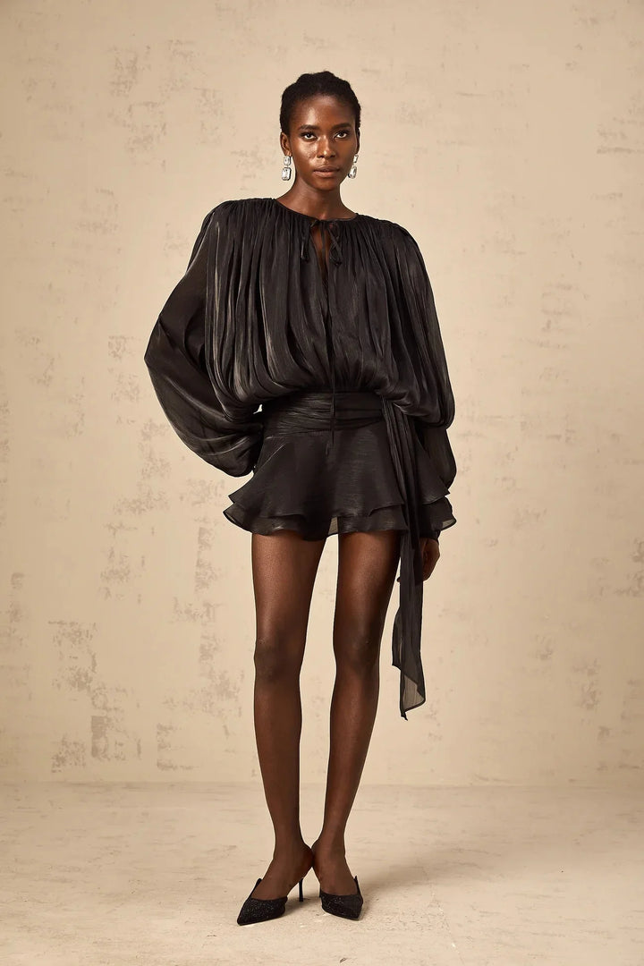 "Camiyah satin mini dress with tie accents in flowing design. Soft and elegant, perfect for any occasion."