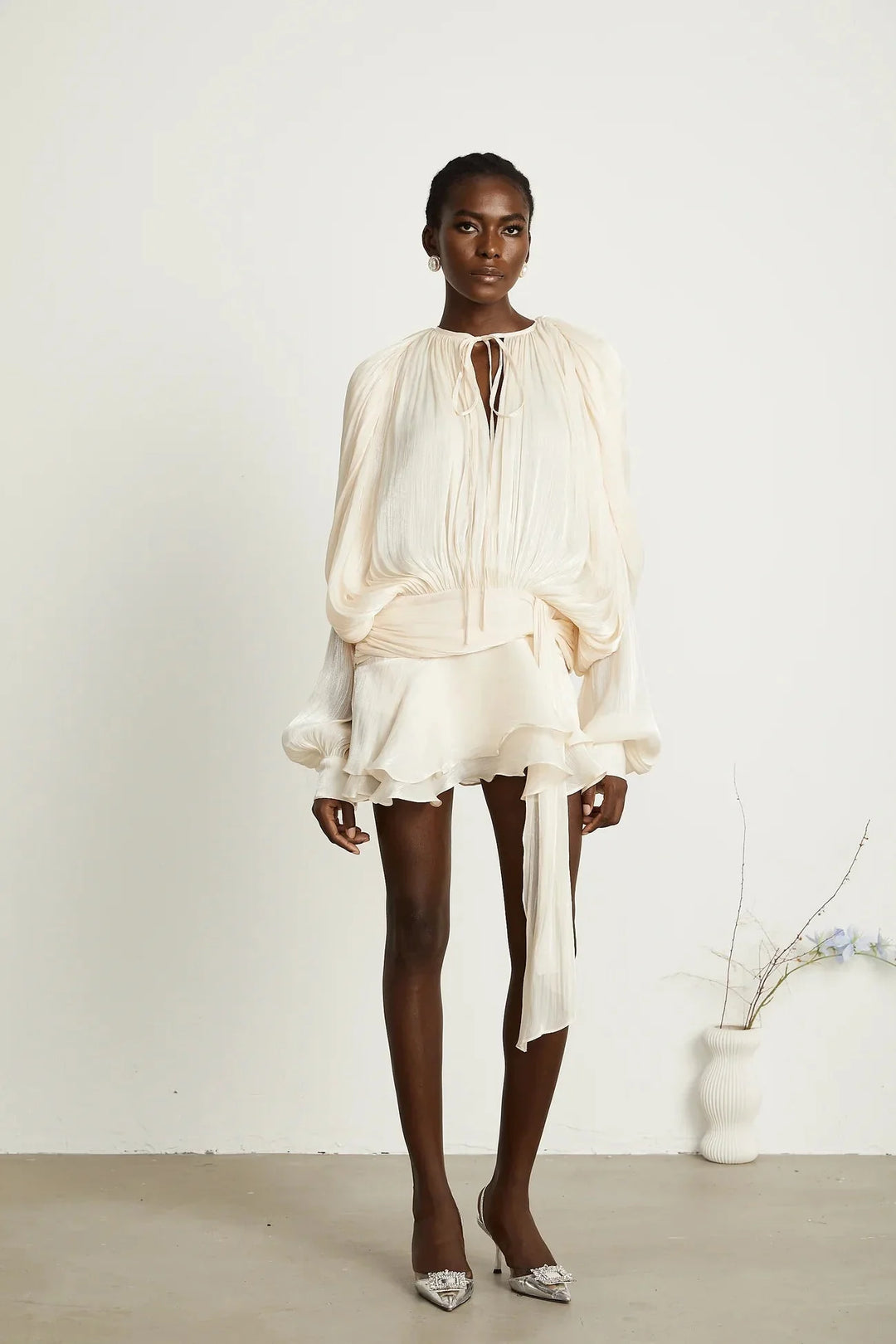 "Camiyah satin mini dress with tie accents, knee-length and flowing design in silky satin fabric"