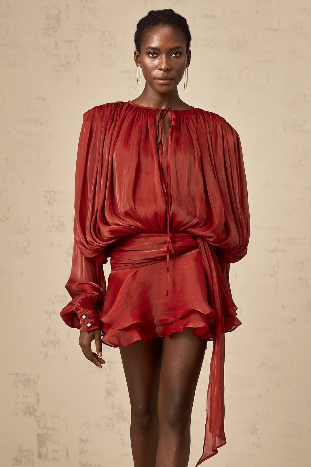 Flowing satin mini dress in Camiyah with tie accents, perfect for a chic and elegant look.