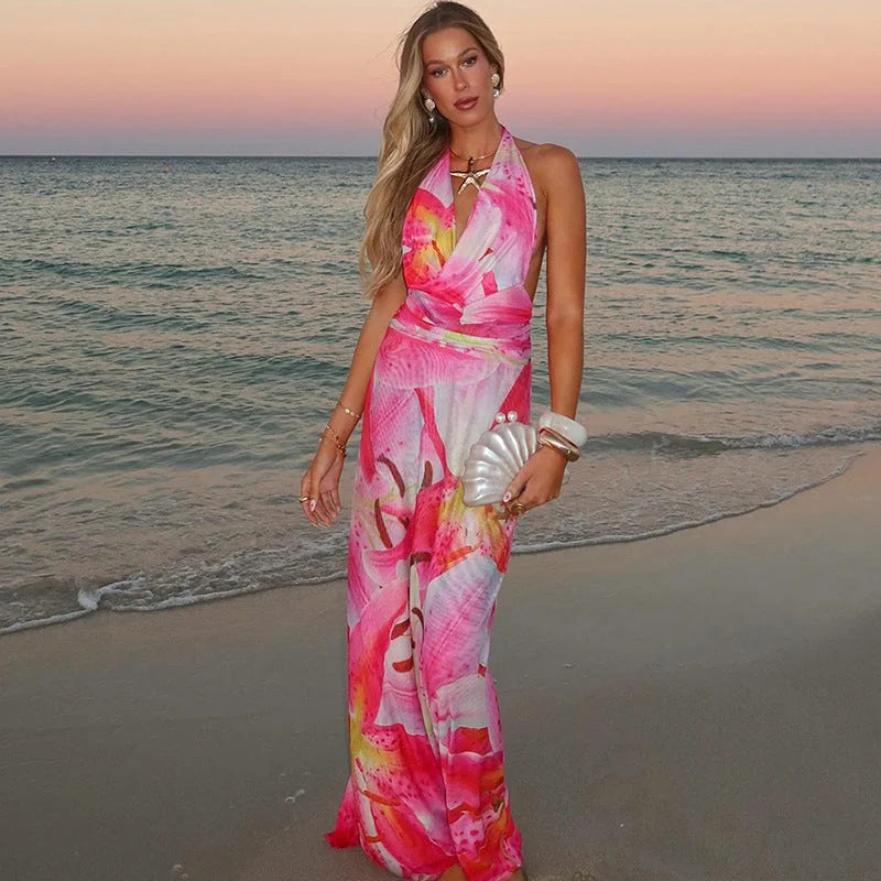Pink tie-neck backless halter maxi dress in Madelyn with a flowy silhouette and intricate tie-neck detail, perfect for summer…