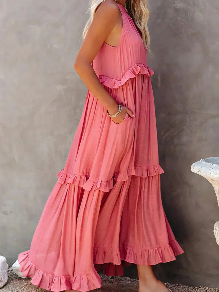"Wylie sleeveless tiered maxi dress in soft, flowing fabric with boho-chic design featuring delicate ruffles and intricate…