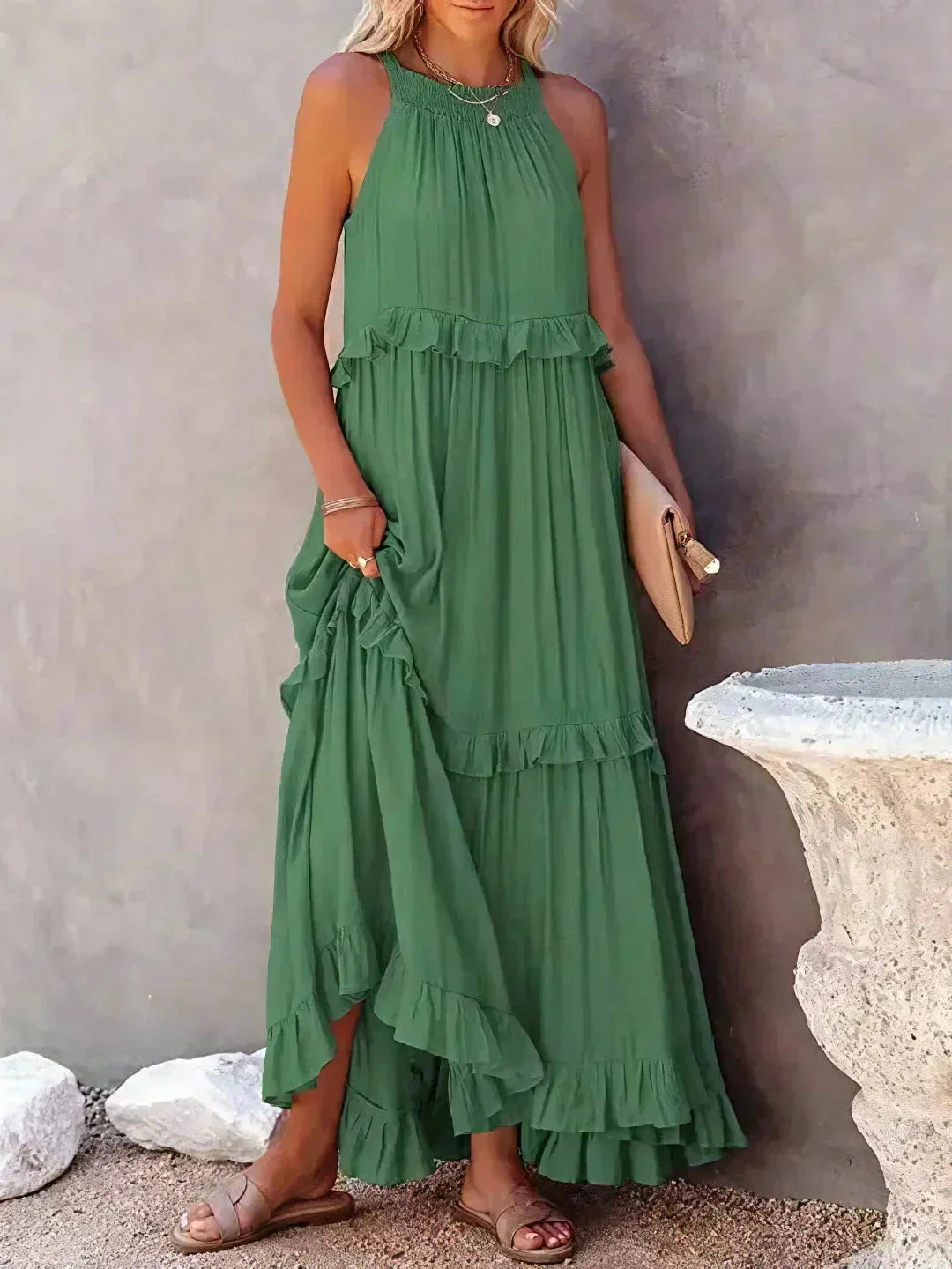 Green sleeveless tiered maxi dress by Wylie. Made of soft cotton blend with a flowy design, perfect for spring and summer…