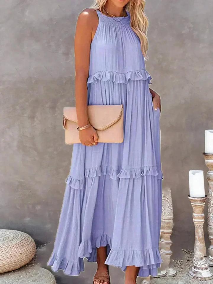 "Lila sleeveless tiered maxi dress in Wylie, made from flowy fabric with delicate ruffle details. Perfect for a chic…