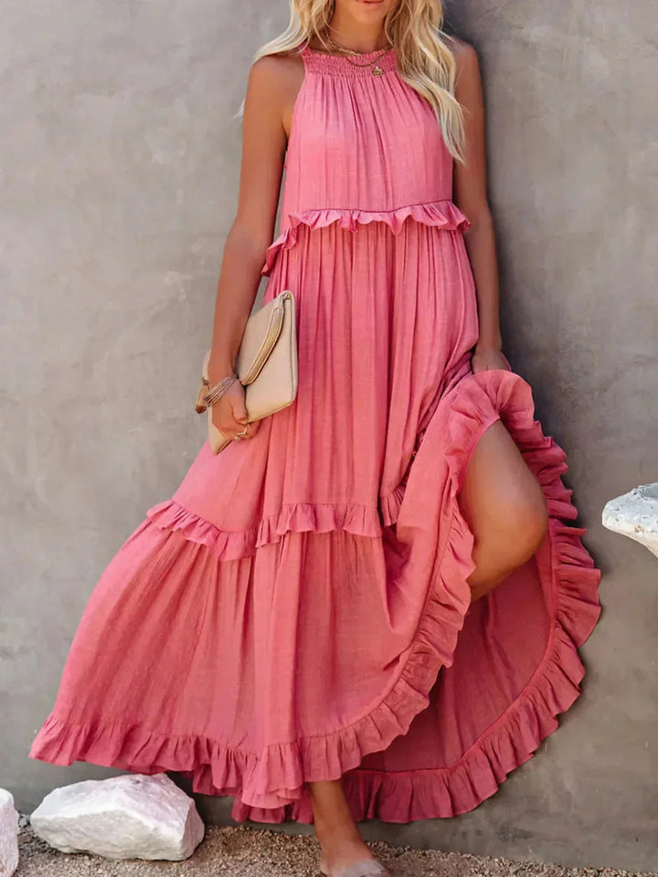Pink sleeveless tiered maxi dress by Wylie, featuring a flowy design and a lightweight fabric perfect for any summer…