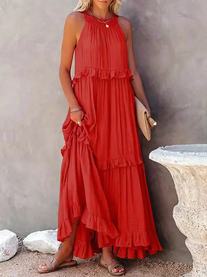"Red tiered maxi dress without sleeves by Wylie, crafted from lightweight flowing fabric ideal for warm weather."