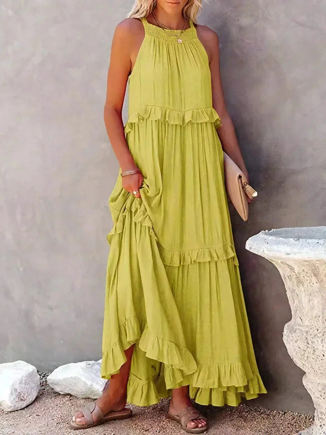 Yellow sleeveless tiered maxi dress by Wylie. Made of lightweight cotton blend, features ruffle tiers and a flowy…