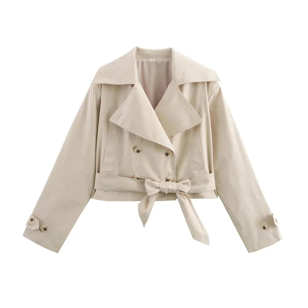 Beige cropped jacket with waist tie, featuring a lightweight linen blend fabric and chic draped design for a trendy and…