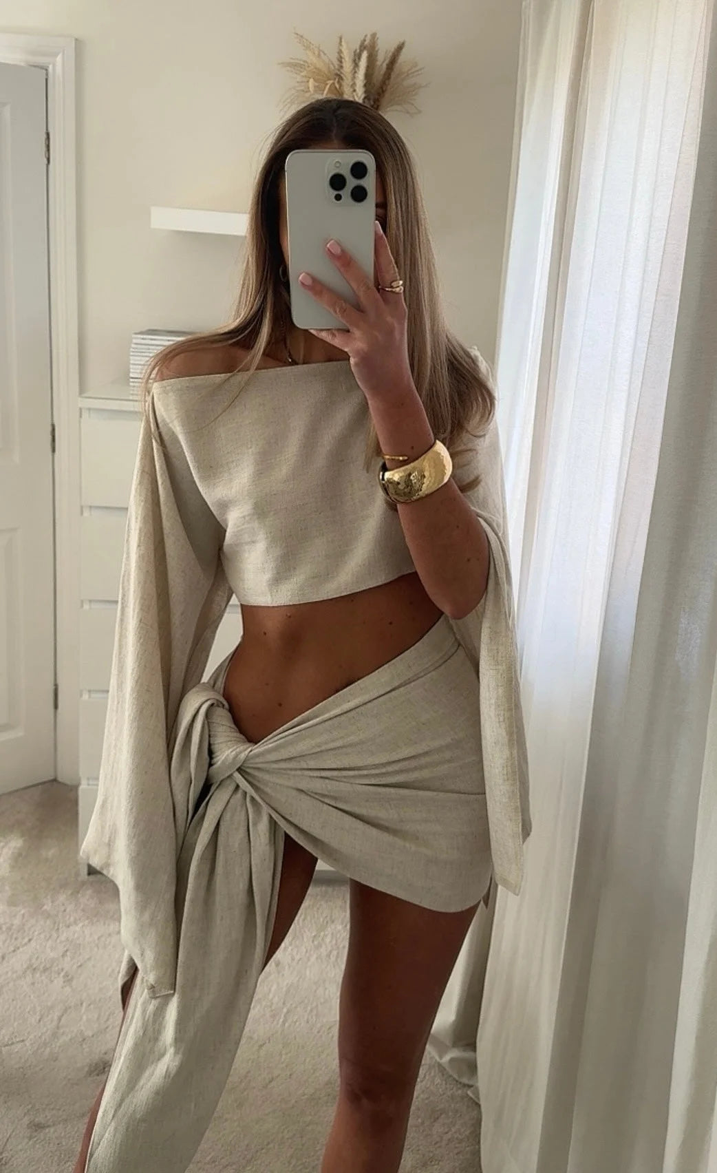 Off White linen two-piece sarong set featuring intricate design details and effortlessly chic style by Heba.