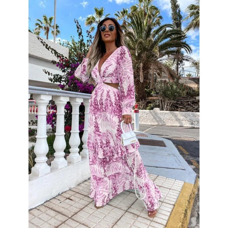 "Flowy purple maxi dress with Avanna floral print design for a bohemian look."