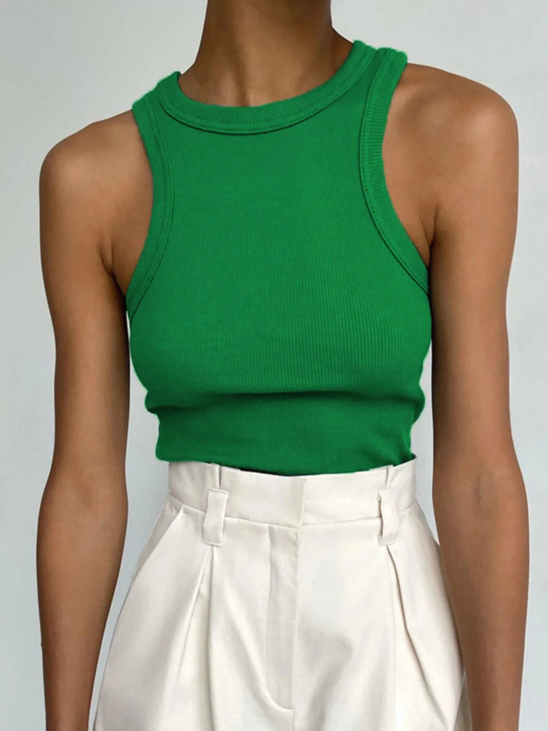 Green ribbed tank top with a sleek design for everyday style. Made of soft, comfortable material for all-day wear.