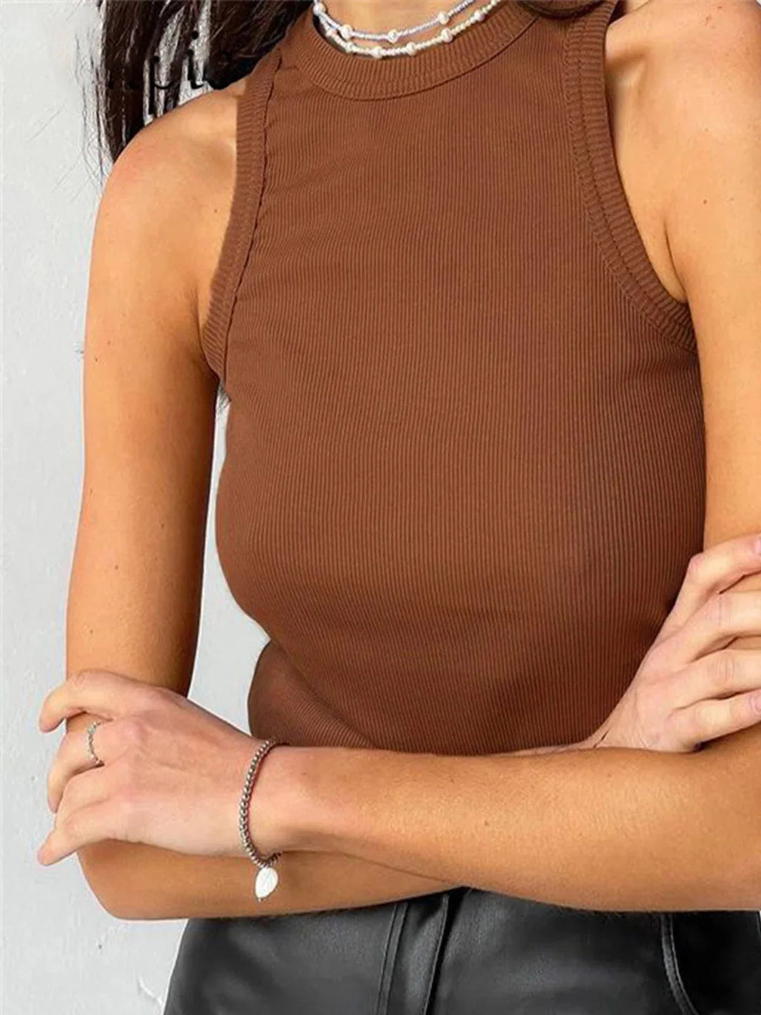 Light brown ribbed tank top made for everyday wear, with a sleek design and a comfortable fit.