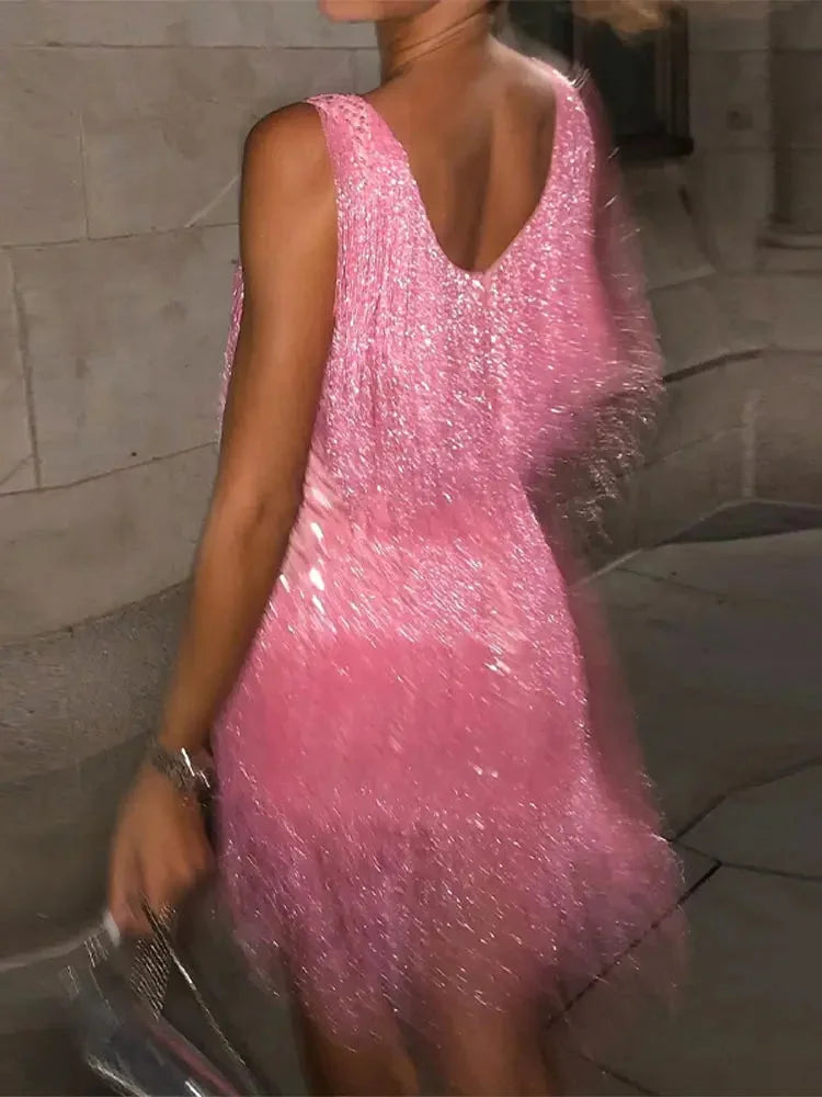 Pink sleeveless mini dress with a shimmering finish, perfect for special occasions. Made from high-quality fabric with a…