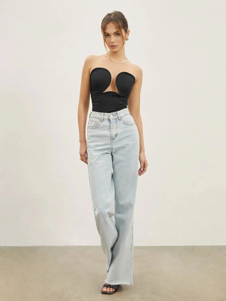 Black strapless top with sweetheart neckline by Rosalynn. Sleek design with a structured fit.