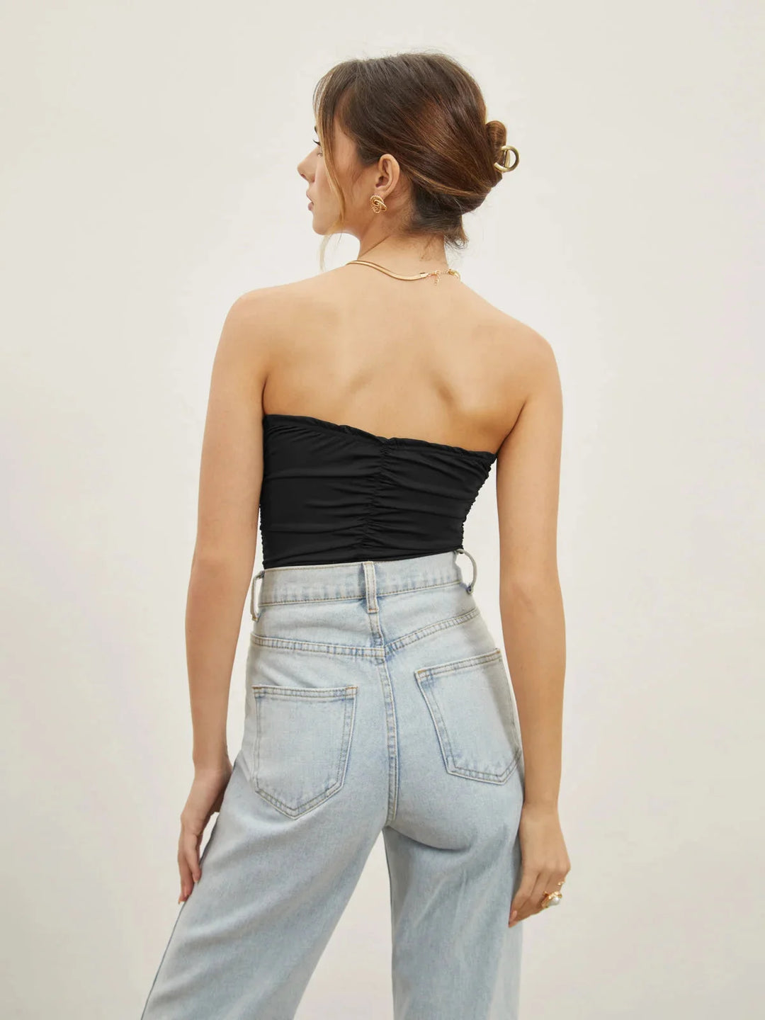 Black strapless top with sweetheart neckline by Rosalynn. The top is elegant, featuring a sleek design that flatters any…