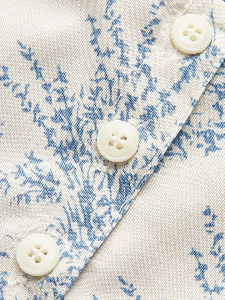 Blue printed bustier top with straps, featuring a bold design. Perfect choice for a stylish and trendy outfit.