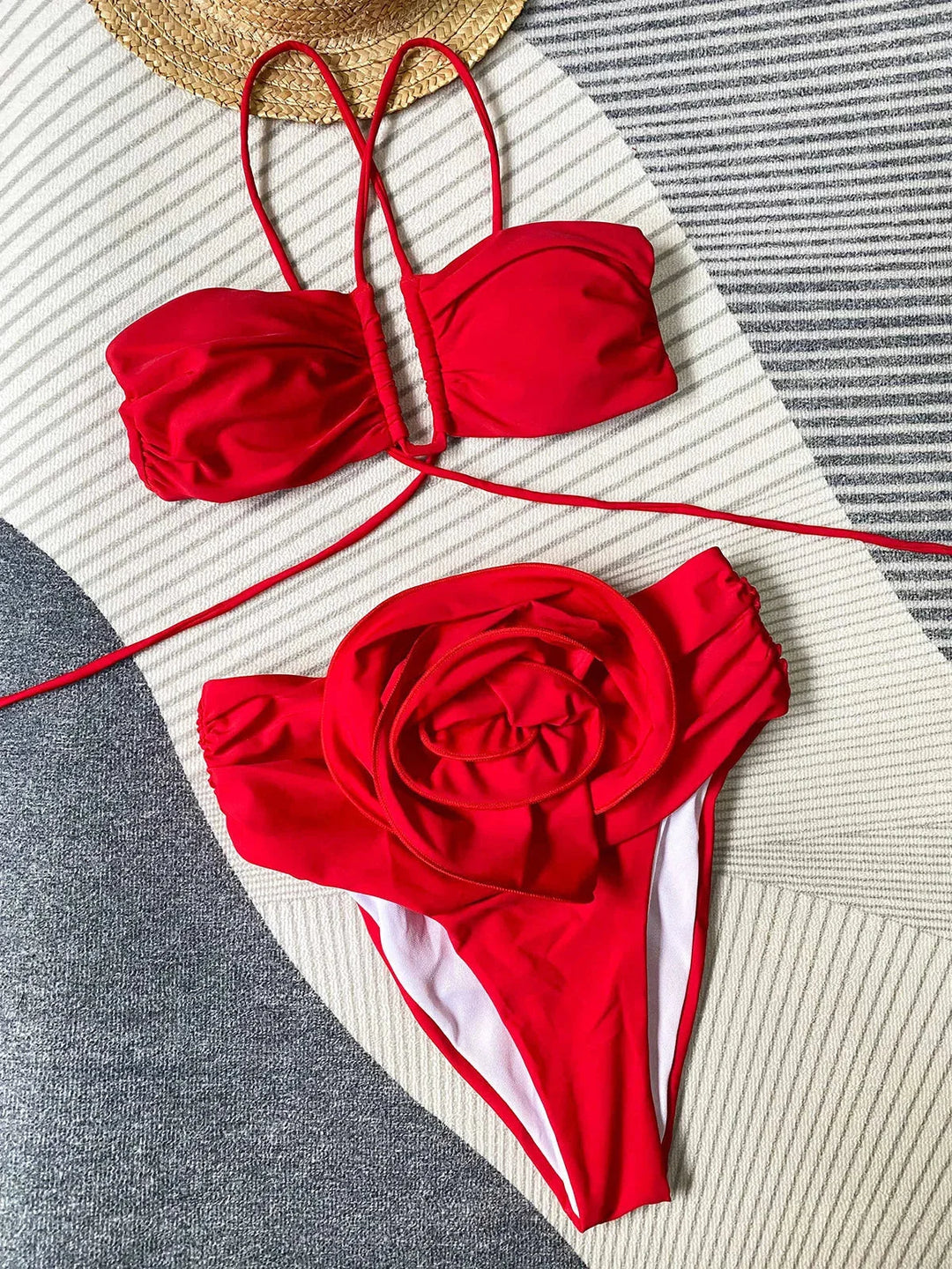 Women’s bikini set with rose appliqué in soft, stretchy fabric. Stylish two-piece swimwear with delicate floral detail on…