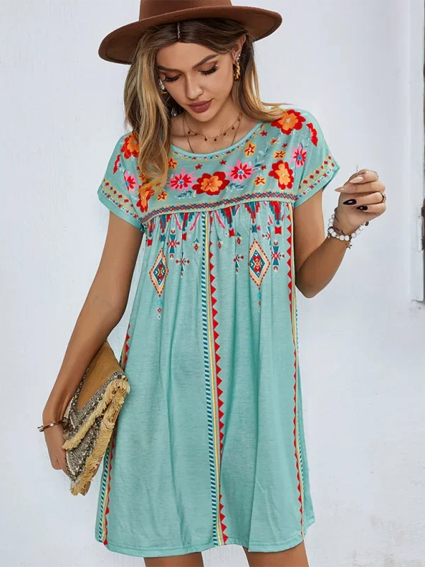 "Nihira embroidered boho mini dress featuring floral embroidery on lightweight linen blend fabric in a relaxed fit."