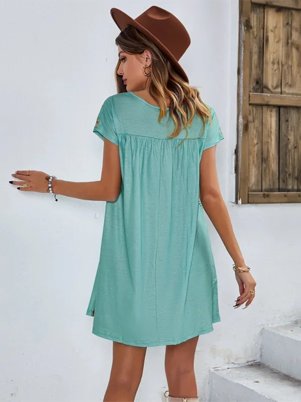 "Nihira embroidered boho mini dress in soft cotton fabric, featuring intricately embroidered details and a relaxed fit."