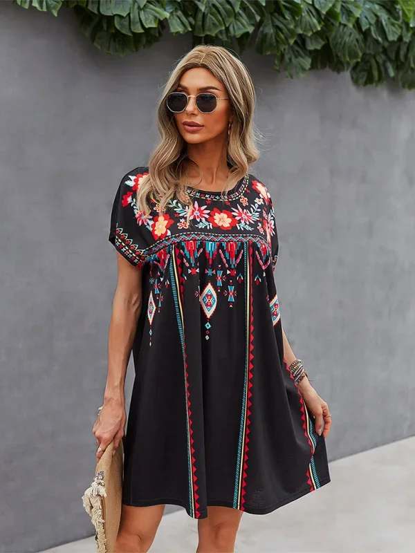 "Black mini dress with intricate boho embroidery detail, perfect for a chic and effortless look."