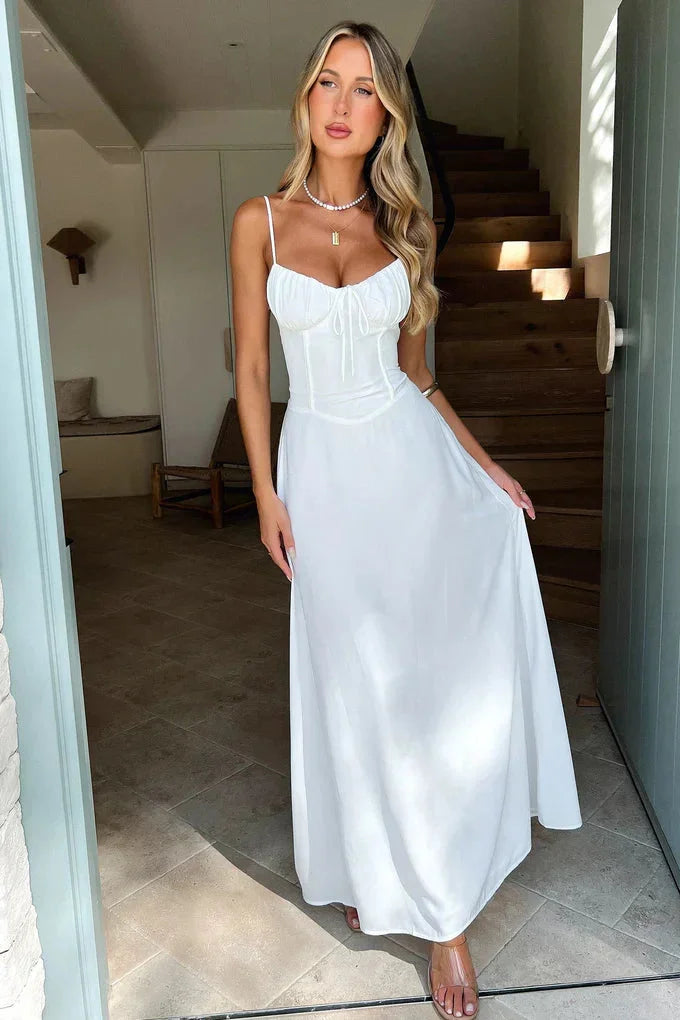"Zoya flowy maxi dress in soft cotton-modal blend, adjustable straps, subtle pleats, and elegant draped silhouette."