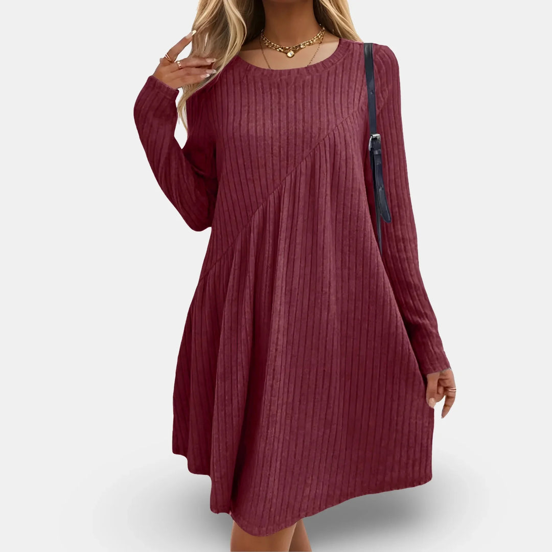 Red textured swing mini dress with long sleeves in Arleth. Soft and stretchy fabric perfect for a casual yet stylish look.