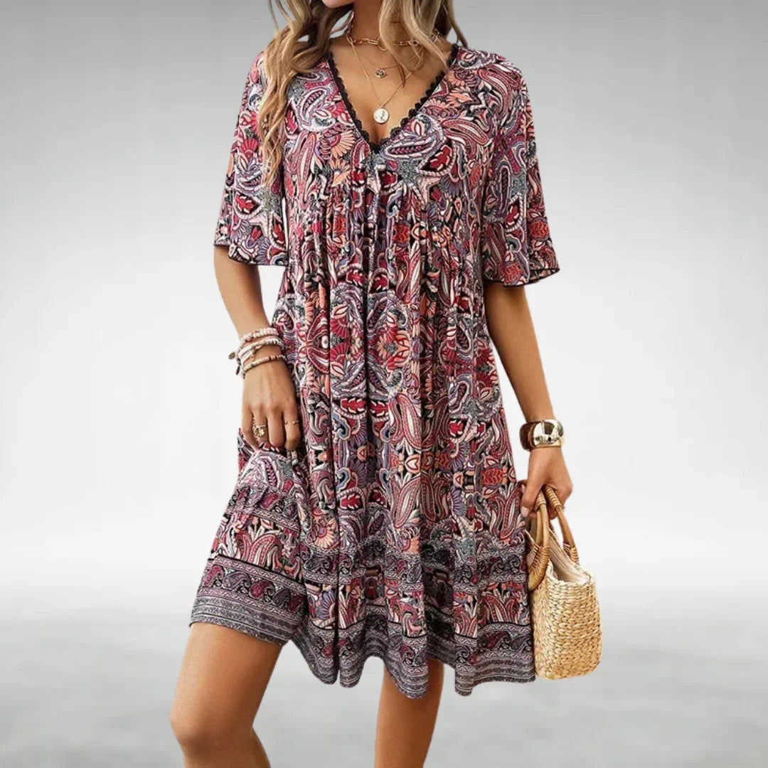 "Red boho mini dress by Erica with relaxed fit and intricate detailing, perfect for casual chic looks."