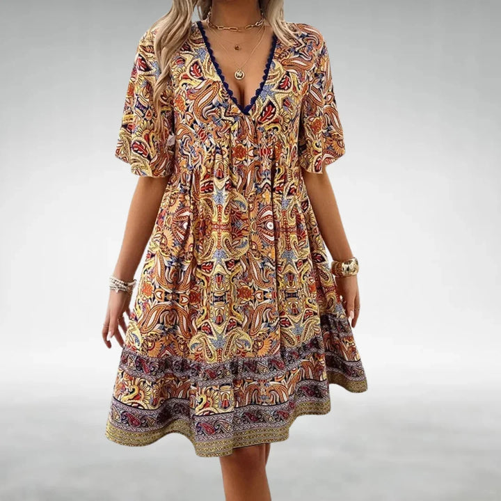 Yellow Erica mini dress with a relaxed fit and boho design, made from soft and breathable fabric.