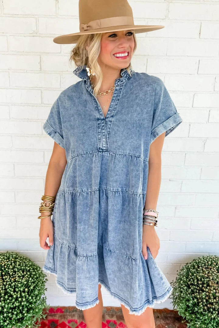 "Acid-wash denim dress with a V-neck design, a versatile and edgy addition to your wardrobe by Marissa."