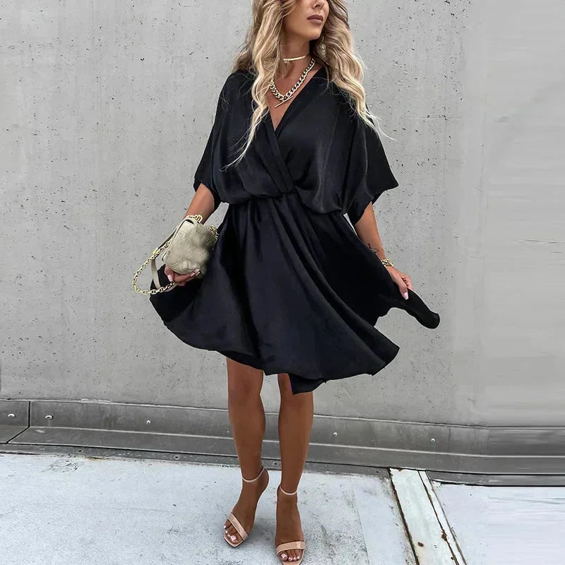 Flowy V-neck mini dress in Leandra color, with a lightweight fabric and elegant silhouette perfect for casual or formal…