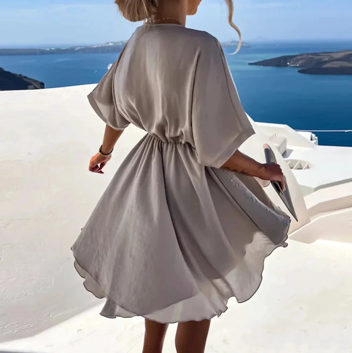 "Leandra - Flowy V-neck mini dress in soft cotton blend with floral print and relaxed fit"