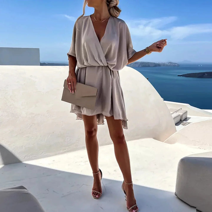 Flowy gray V-neck mini dress in soft, breathable fabric with delicate Leandra print. Perfect for casual chic vibes.