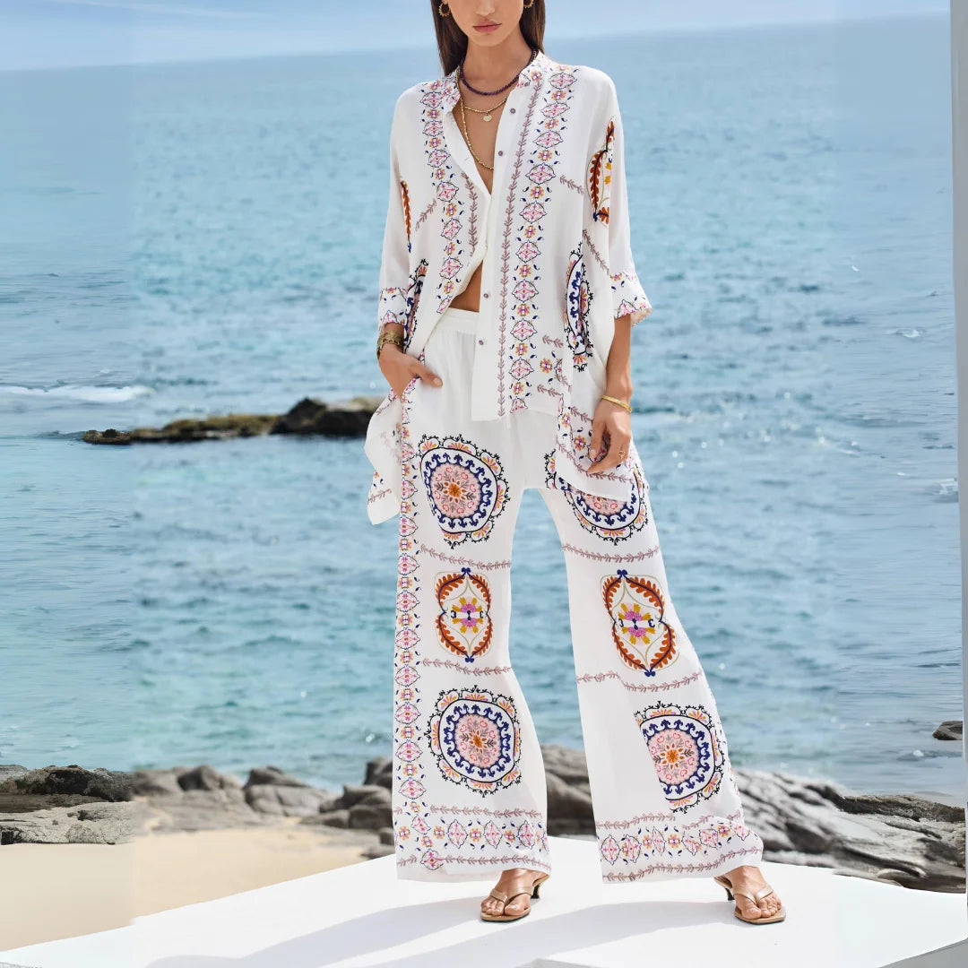 "Aryiah bohemian set with floral embroidery, flowing skirt, and bell sleeves for versatile spring days."