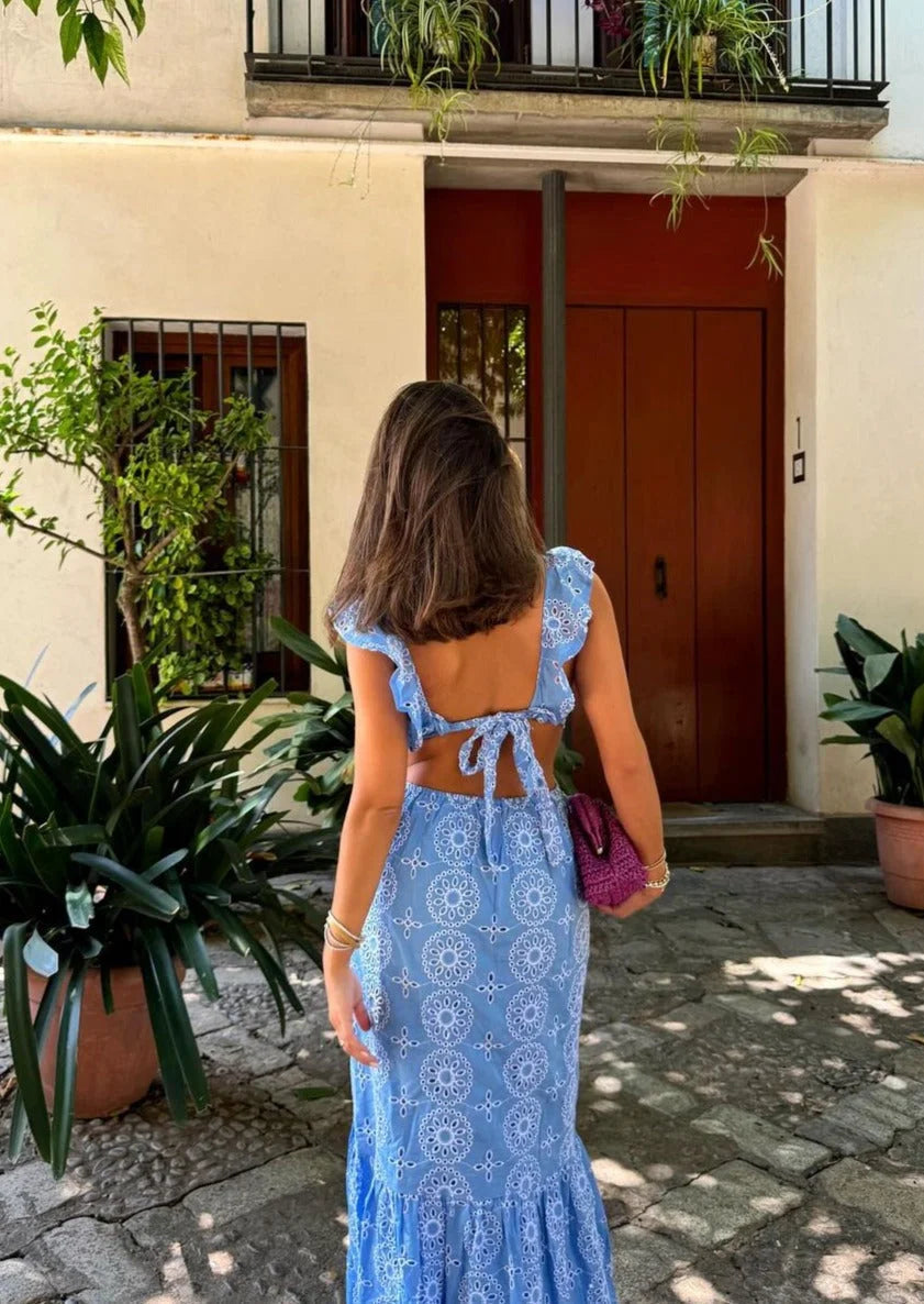 Blue patterned maxi dress with ruffles, made from soft and flowing fabric. Perfect for a chic and stylish look for any…
