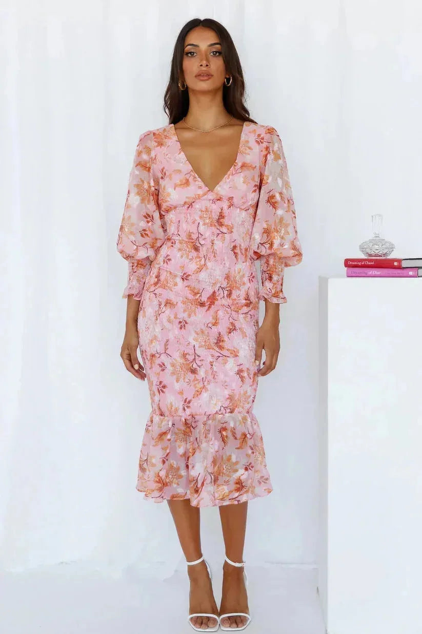 Pink Perel midi dress with flattering ruching detail, flared hem, and a comfortable fit. Perfect for a stylish and feminine…