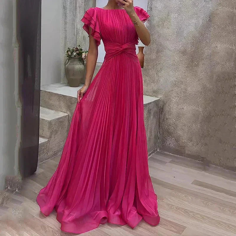 "Fanta maxi dress featuring pleats, ruffled sleeves, and flowing silhouette in a lightweight fabric."