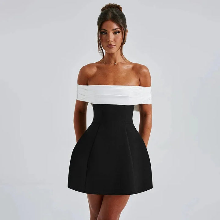 Black off-shoulder dress by Cindy featuring a sleek two-tone design. Made of high-quality fabric with a flattering and…