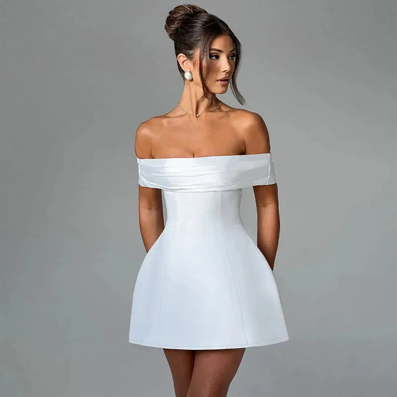 "White off-shoulder dress with sleek two-tone design, perfect for a chic and trendy look."